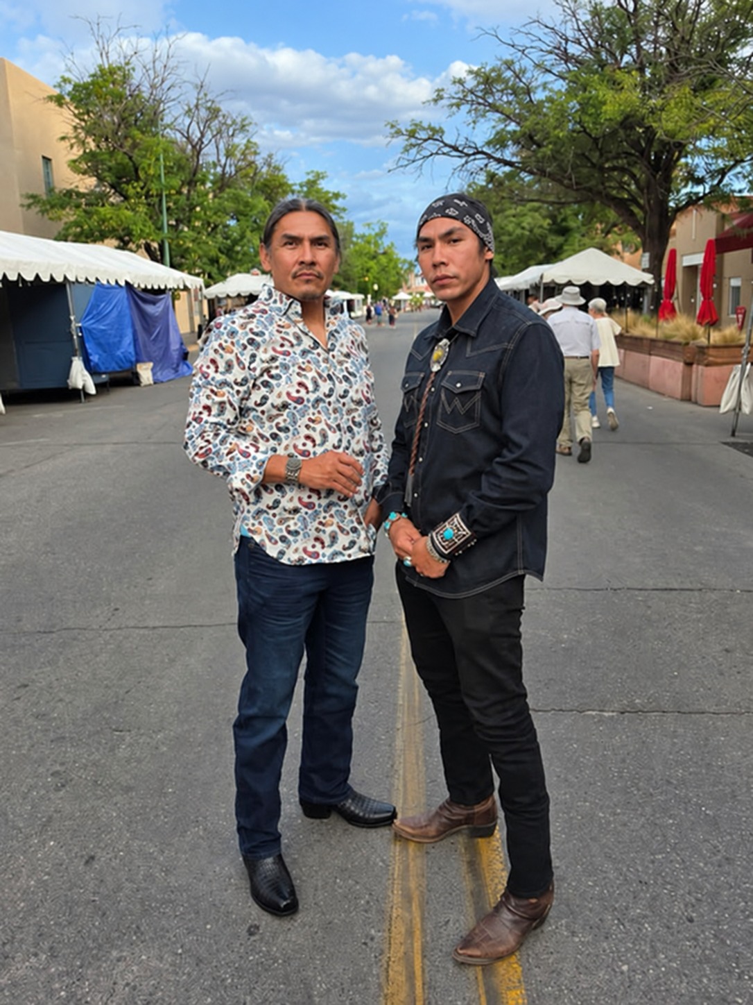Reggie and Bronson Mitchell together at an outdoor market